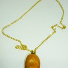 FASHION PEACH COLORED PENDANT ON A GOLD CHAIN DRESS