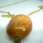 FASHION PEACH COLORED PENDANT ON A GOLD CHAIN DRESS