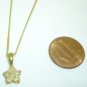 CHARMING BEJEWELED FLOWER PENDANT ON A GOLD TONED CHAIN