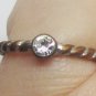 SWIRL RING WITH CLEAR STONE/GLASS BAND