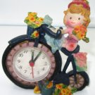 DECORATIVE QUARTZ NOVELTY DESK SHELF MANTEL CLOCK BABY GIRL BIKE RIDER