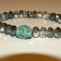 CRYSTAL BRACELET WITH SKULL CHARM