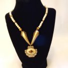 Ivory look beads with burnish gold look drop pendant and rose motif
