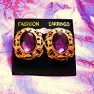 Gold cast w/ purple stone center