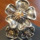 Silver flower ring with light orange accent jewels