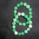 Beautiful combination of two green beads with silver accents