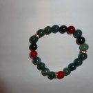 Multi-shade green bead bracelet with some red and gold for effect
