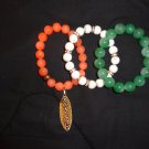 Green, orange and off-white combination bracelets for that statement look