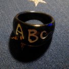 Size 8.5 Black Plastic "ABC" Ring