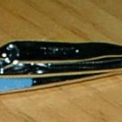 FINGER NAIL CLIPPER WITH CLIPPING RETAINER AND NAIL FILE