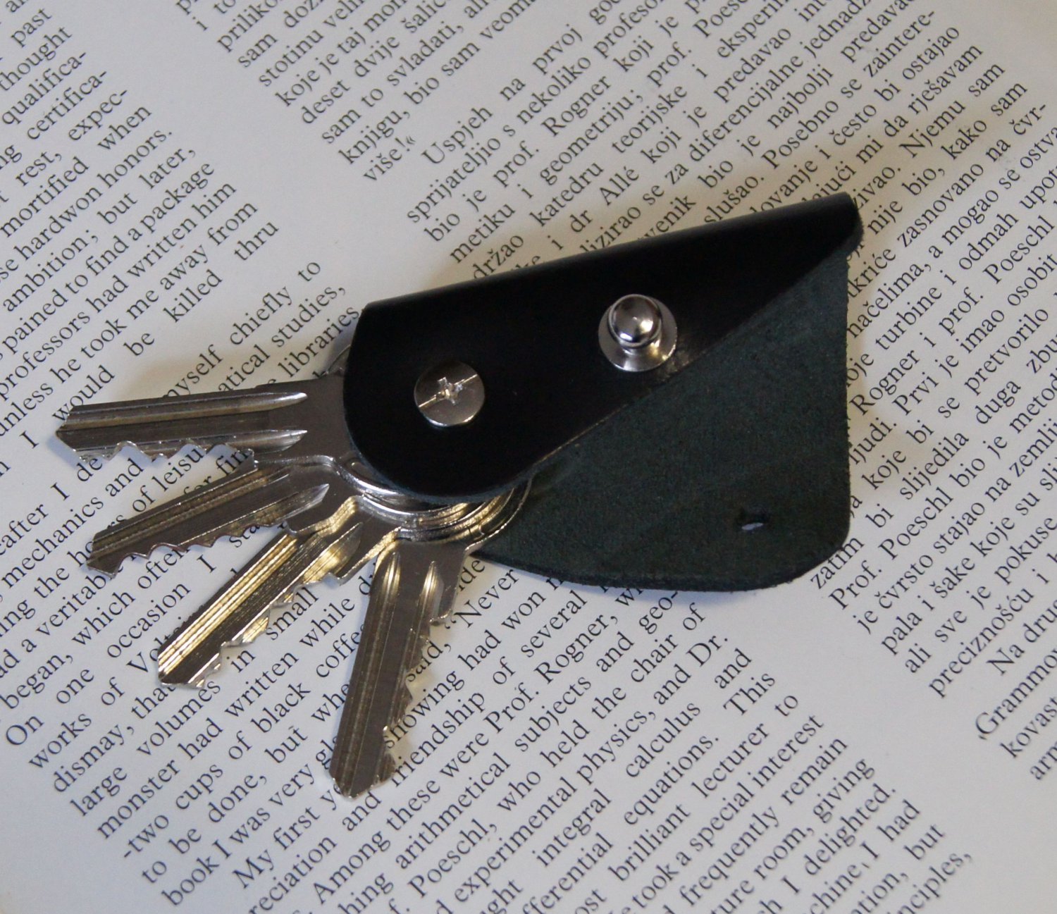 Leather keychain, key holder, holds 1- 4 regular keys