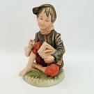 Norleans Figurine Sitting Paper Boy with Newspapers Porcelain Japan