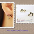 Black butterfly earring.