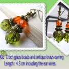 Czech glass bead & antique brass earring.