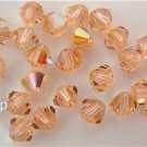 5 5mm Swarovski 5301 Crystal Bicones -- Light Peach AB