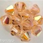 5 5mm Swarovski 5301 Crystal Bicones -- Light Peach AB