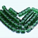 25 7 x 9 mm Czech Glass Druk Roller Beads: Kelly Green