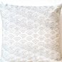 Ivory white throw pillows with detailed embroidered waves