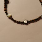 Shell with tiger eye
