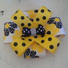 Yellow black and white floral polka dotted bow
