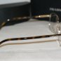 Brand New Prada Gold/Tortoise Eyeglasses: Mod. VPR 64M (AAX-1O1) 55-17 & Case