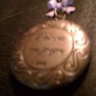 Twilight Breaking Dawn Locket like Bella gives Reneesme with pink bow