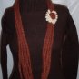 Handmade Infinity scarf/ necklace in rust brown with a cream flower