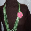 Handmade Infinity scarf/ necklace in multi greens with a pink flower