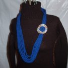 Handmade Infinity scarf/ necklace in royal blue with added yoyo