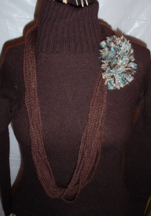 Handmade Infinity scarf/ necklace in a two tones of brown  with a large multi colored pom-pom