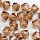 72 4mm Swarovski Crystal 5328 Xilion bead Lt Smok Topaz