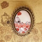 In a field of poppies brooch