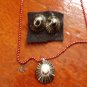 NEW. Item 026. Black and gold Limpet shell necklace with matching earrings.
