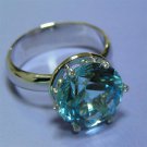 A Diamond and Topaz Cocktail Gold Ring