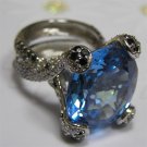 Blue Topaz Ring, on Gold set Diamonds