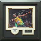 Usain Bolt Autographed 2012 Olympic Photo Framed