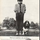 1961 Polaroid Camera Ad "Don't just stand there"