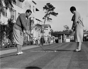 Babe Ruth teaching his daughter how to Golf great photo