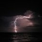 BEAUTIFUL LIGHTNING STRIKE OVER OCEAN COLOR PHOTO CLOUDS WAVES NATURES FORCE