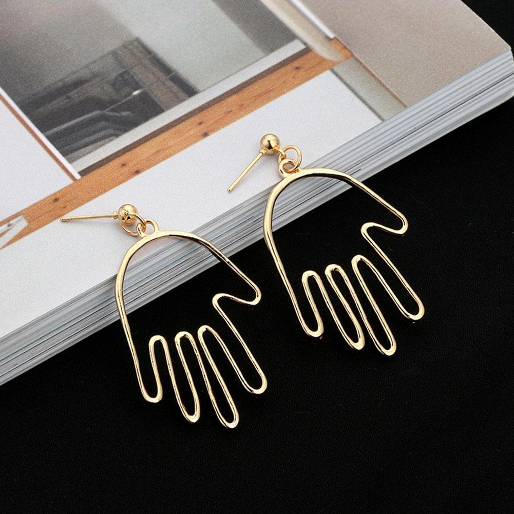 women hand funny earring