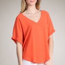 orange asymmetrical top