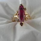 14kt Yellow Gold Fashion Ring w\ large Synthetic Ruby and 2 White C Z Stones