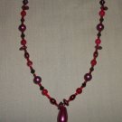 Burgundy with red necklace