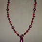 Burgundy with red necklace