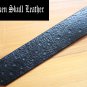 Wide black leather cuff with hand tooled background with shamrocks