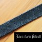 Dark green leather cuff with hand tooled argyle design