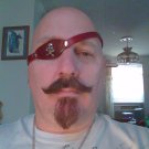 Leather eye patch with skull and cross bones