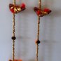 Colourful strings of hanging birds with bell.