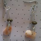 Shell earrings with wooden bead accents.