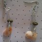 Shell earrings with wooden bead accents.